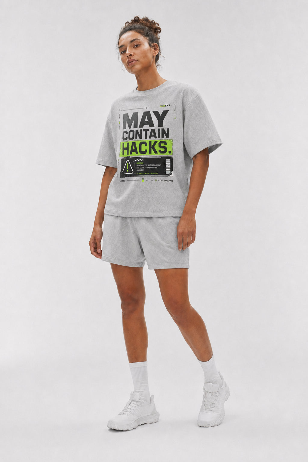 Uncropped full-body view of a model wearing the Athletic Heather May Contain Hacks oversized boxy tee.