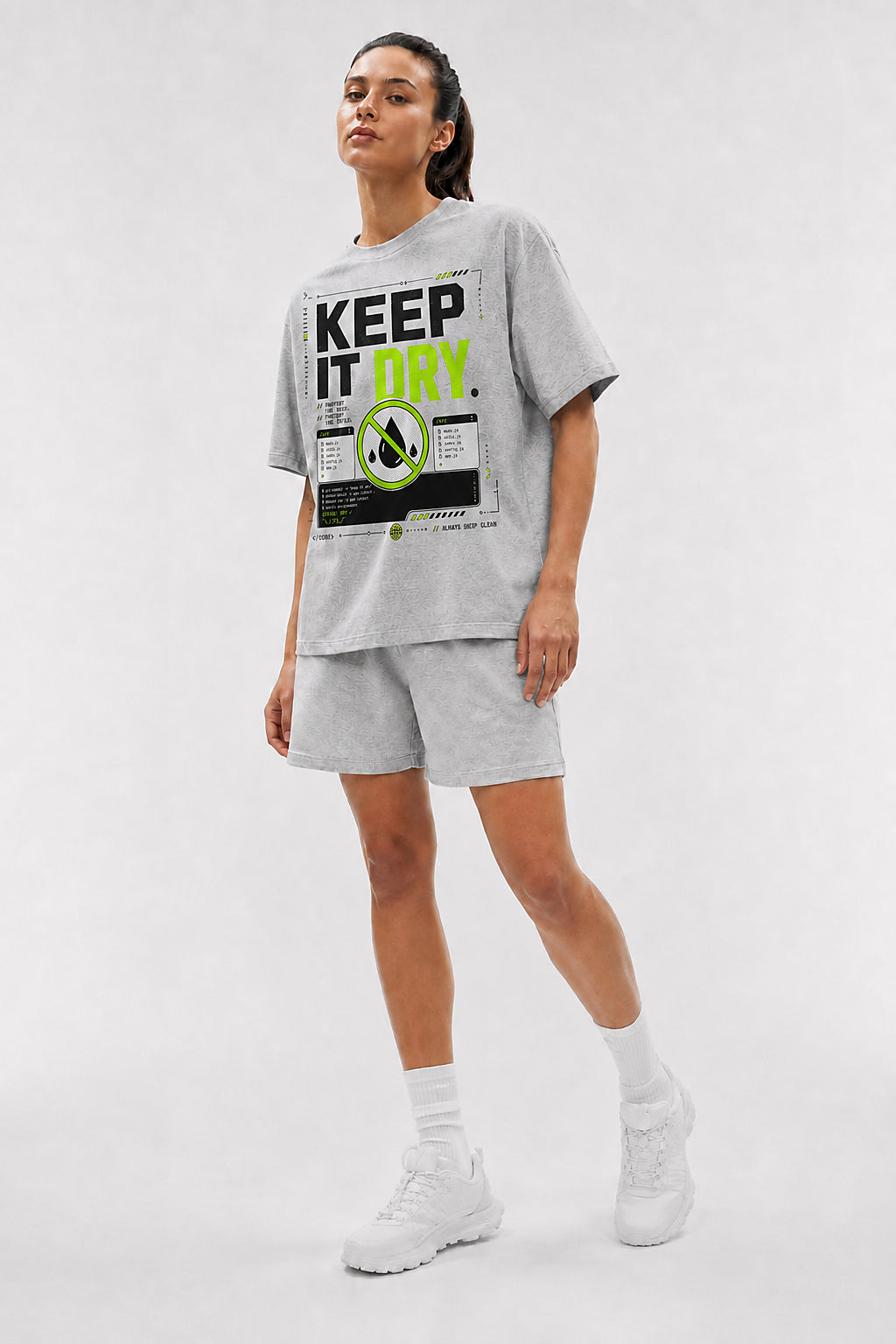 Uncropped full-body view of a model wearing the Athletic Heather Keep It DRY oversized boxy tee.