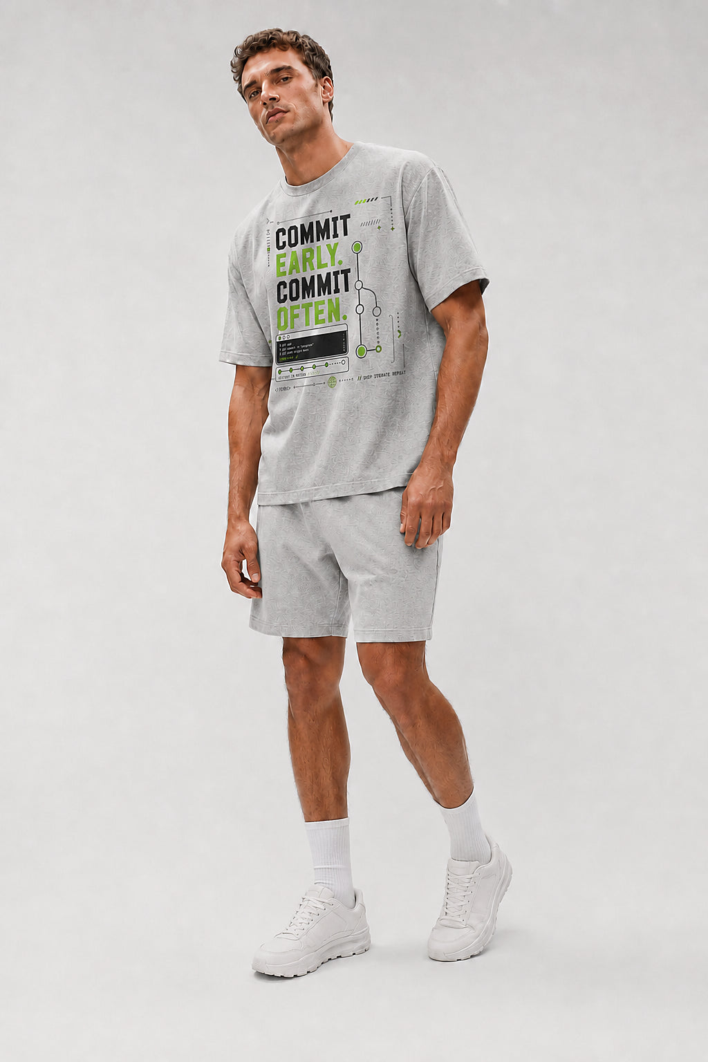 Uncropped full-body view of a model wearing the Athletic Heather Commit Early. Commit Often. oversized boxy tee.