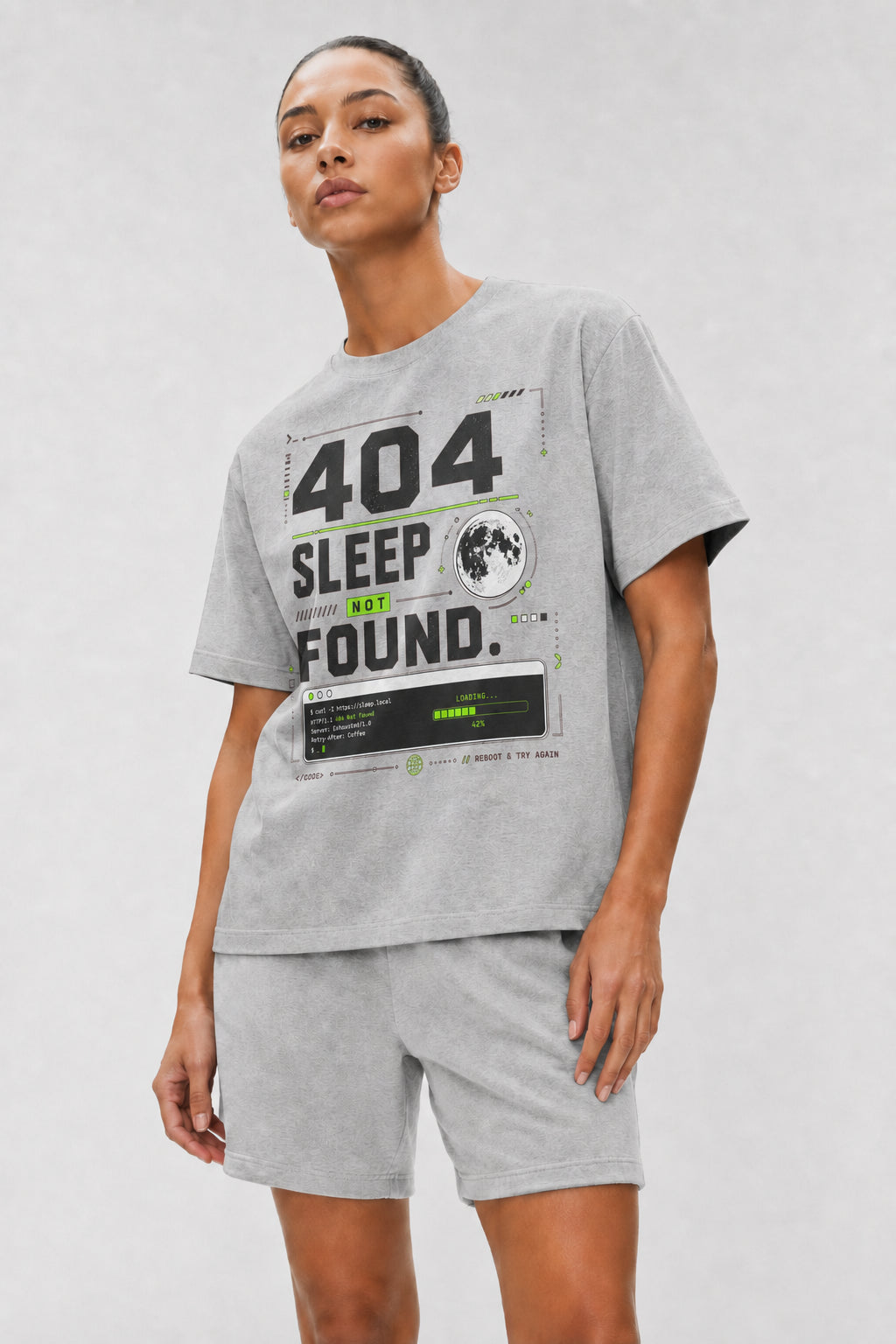 Head-safe close-up of a model wearing the Athletic Heather 404 Sleep Not Found oversized boxy tee.
