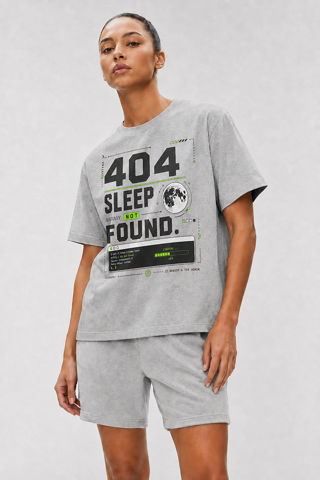 Head-safe close-up of a model wearing the Athletic Heather 404 Sleep Not Found oversized boxy tee.