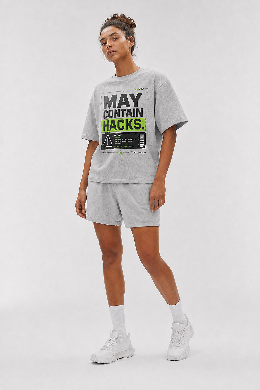 Uncropped full-body view of a model wearing the Athletic Heather May Contain Hacks oversized boxy tee.