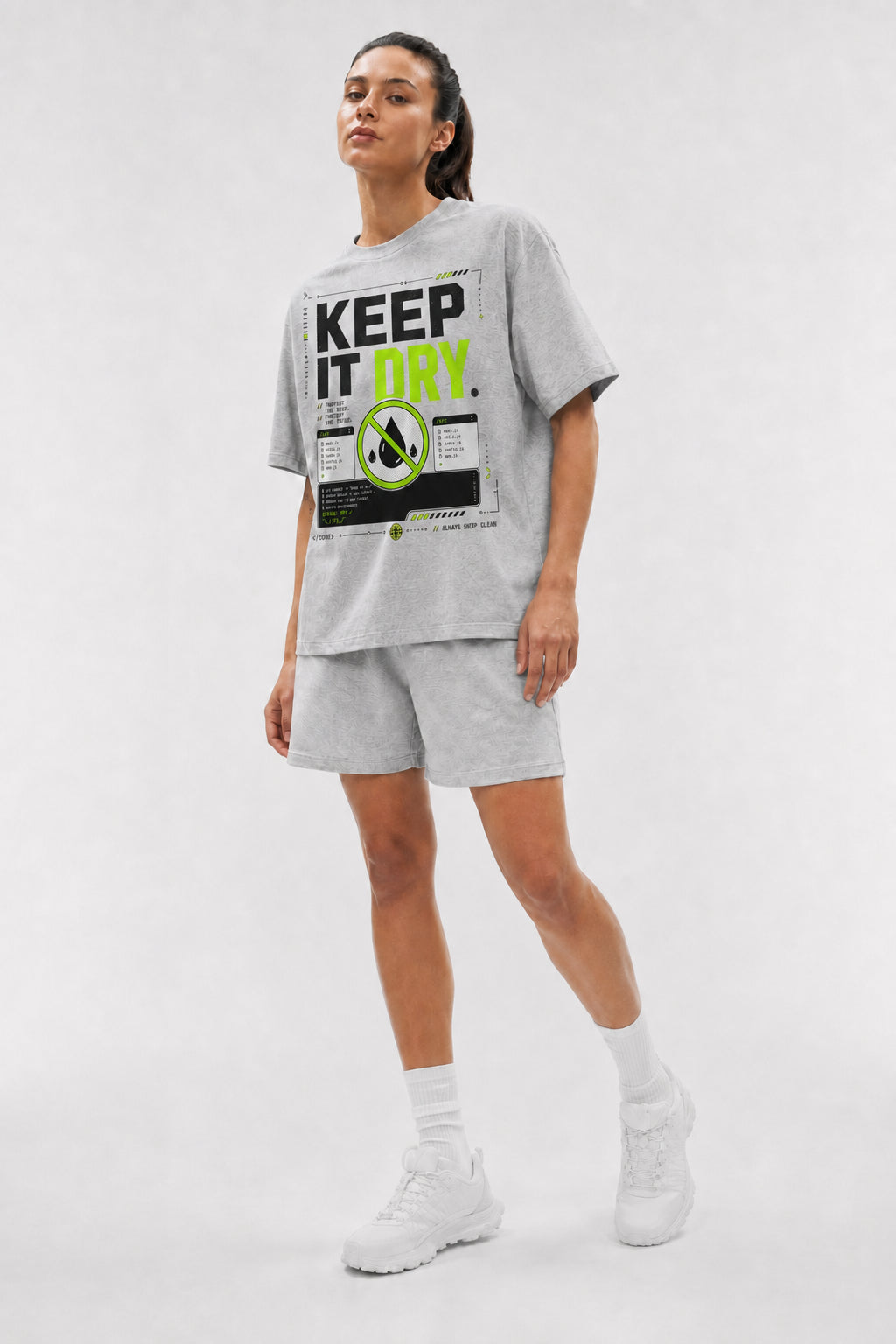Uncropped full-body view of a model wearing the Athletic Heather Keep It DRY oversized boxy tee.