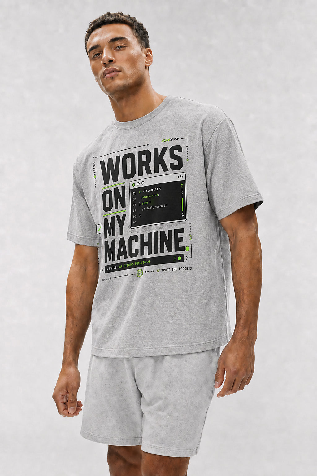 Head-safe close-up of a model wearing the Athletic Heather Works on My Machine oversized boxy tee.