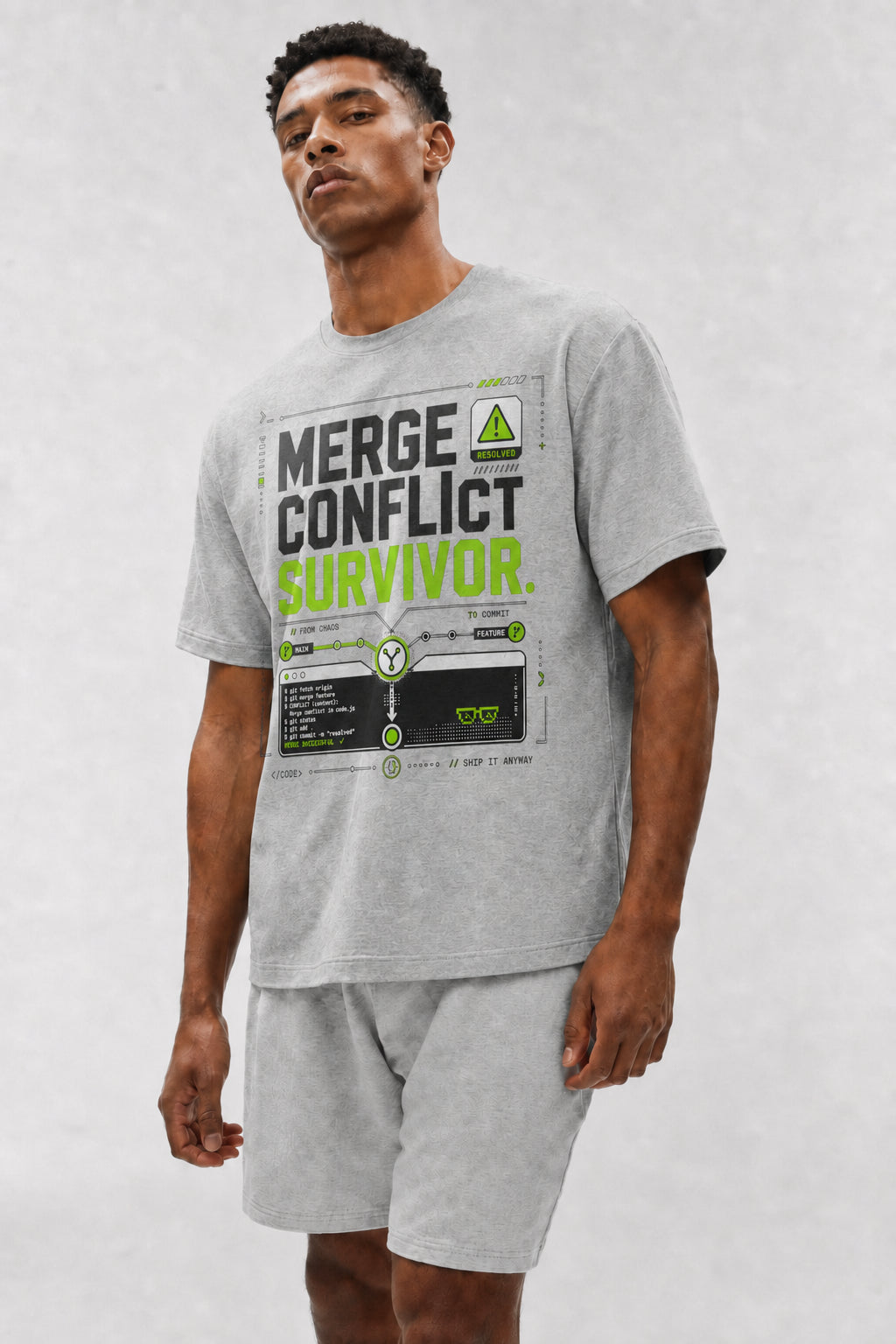 Head-safe close-up of a model wearing the Athletic Heather Merge Conflict Survivor oversized boxy tee.